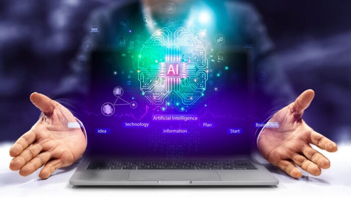 ai-neon-gettyimages-1965212714.jpg Neon sparkles rise up from a laptop with the floating letters AI