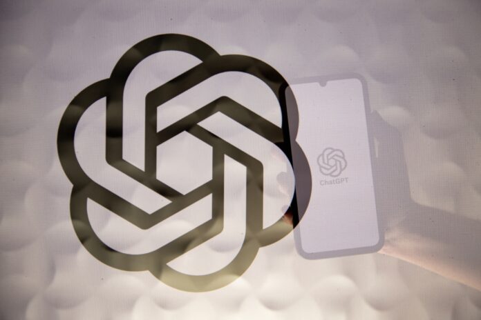 openai-logo-superimposed-reflection-phone.jpg OpenAI logo superimposed on a reflection of a phone