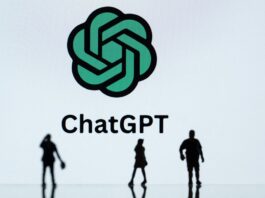 This photograph taken in Mulhouse, eastern France on October 19, 2023, shows figurines next to the ChatGPT logo. (Photo by SEBASTIEN BOZON/AFP via Getty Images)