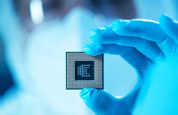 4015386-0-91486100-1751373188-shutterstock_2101584595.jpg The scientist works in a modern scientific laboratory for the research and development of microelectronics and processors. Microprocessor manufacturing worker uses computer technology and equipment.