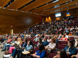 Conference attendees listen to presenters during Teaching and Learning with Technology conference.