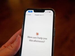 Close-up of a person's hand holding a smartphone and using the Opus 4 model within the Claude app from AI company Anthropic, Lafayette, California, May 22, 2025. (Photo by Smith Collection/Gado/Getty Images)