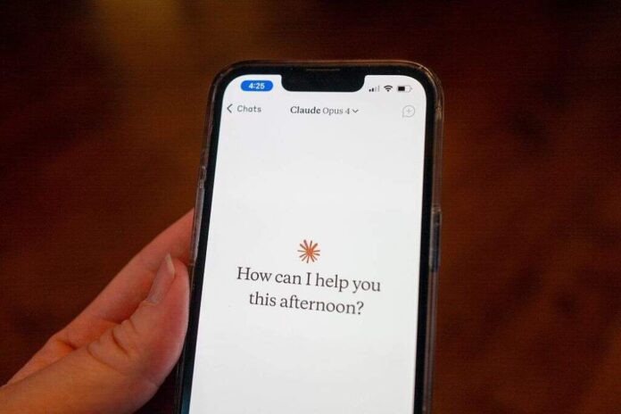 GettyImages-2216579124-1000x667.jpg Close-up of a person's hand holding a smartphone and using the Opus 4 model within the Claude app from AI company Anthropic, Lafayette, California, May 22, 2025. (Photo by Smith Collection/Gado/Getty Images)