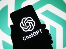 ChatGPT logo of a chatbot launched by OpenAI is seen on a smartphone in a hand.