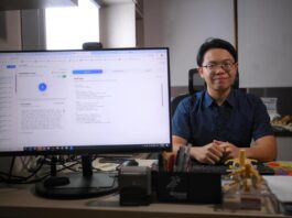 18-year-old John Tow, a second-year Anglo-Chinese School (Independent) student that has coded SGscribe, an AI-powered medical transcription device that converts recordings of doctor's consultations to SOAP notes, pictured with an example of the landing page on July 7, 2025.