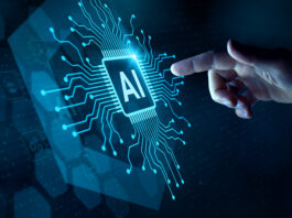 A hand reaching out to touch a futuristic rendering of an AI processor.