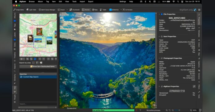 digiKam-8.7.0-PetaPixel-BG.jpg A screenshot of a photo editing software showing a vivid image of a river canyon at sunset, with steep cliffs, green trees, bright blue water, and a curved dam, alongside editing tools, photo info, and a map preview.