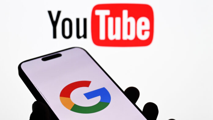 ANKARA, TURKIYE - JULY 2: In this photo illustration, the logo of &#039;Google&#039; is seen on a mobile phone screen in front of the logo of &#039;Youtube&#039; displayed on a computer in Ankara, Turkiye on JUly 2, 2025. (Photo by Ismail Aslandag/Anadolu via Getty Images)