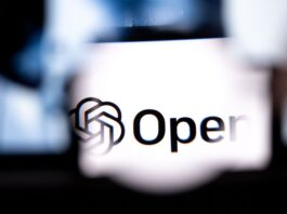 A computer showing OpenAI's logo