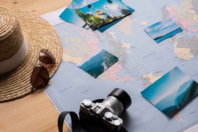 places-for-travel-2025-03-15-06-32-50-utc-1.jpg A map with camera and photos for travel vacation.