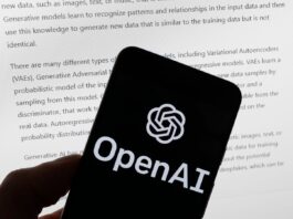 FILE - The OpenAI logo is seen on a mobile phone in front of a computer screen displaying output from ChatGPT, March 21, 2023, in Boston. Several news organizations, writers and photographers groups are seeking regulations to govern the fast-moving artificial intelligence technology that threatens upheavals for their businesses. In an open letter sent on Wednesday, Aug. 9, 2023, outlined priorities for setting rules on the technology, which is developing faster than regulators can keep up with. 