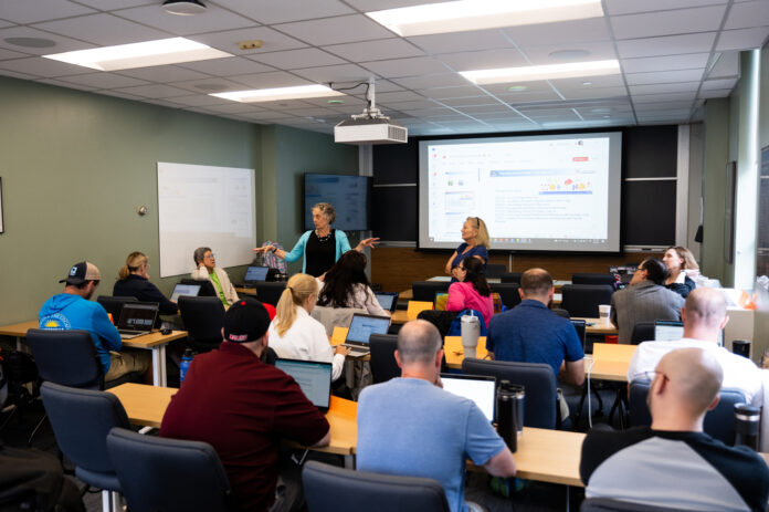 070825_AS_AI_in_Teaching_005.jpg Faculty attend a workshop in a classroom setting.