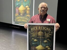 man holding poster