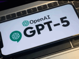 Image of a phone with chatgpt logo on a keyboard