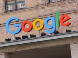 Google corporate logo hangs outside the Google Germany offices