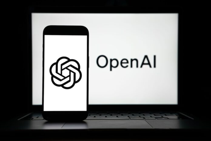 GettyImages-2207801992.jpg the logos of Open AI displayed on both computer and smart phone screen