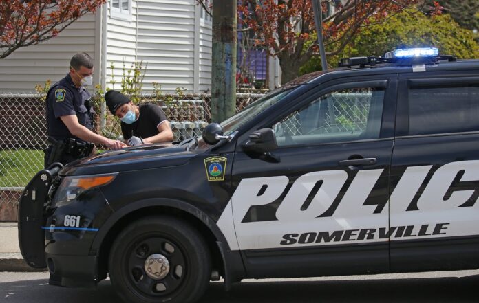 A Somerville police officer issued a summons to a pedestrian in 2020.