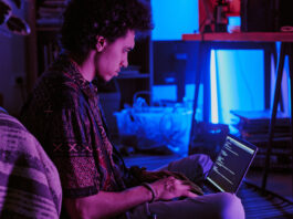 Person coding on computer