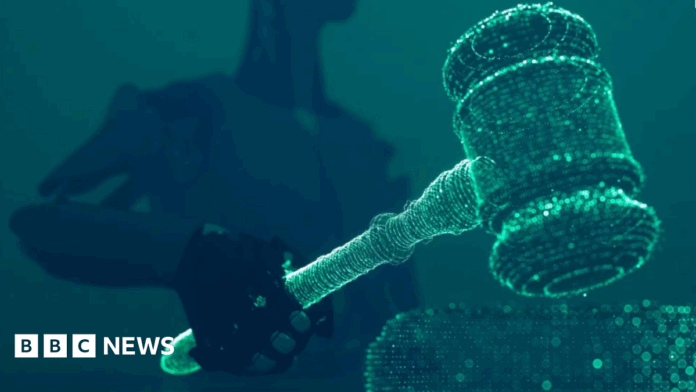 8b876d00-9561-11f0-a3c3-898ca8bade9c.png A robot holding and lowering a judge's gavel.