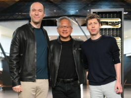 (L to R): OpenAI President Greg Brockman, NVIDIA Founder and CEO Jensen Huang, and OpenAI CEO Sam Altman are seen standing side by side.
