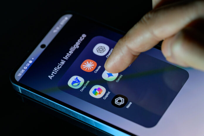 GettyImages-2197823918-resizeed.jpg A photo of someone's smartphone with a folder full of AI apps: DeepSeek, Claude, ChatGPT, Copilot, Gemini, AI Photo, and Nova.