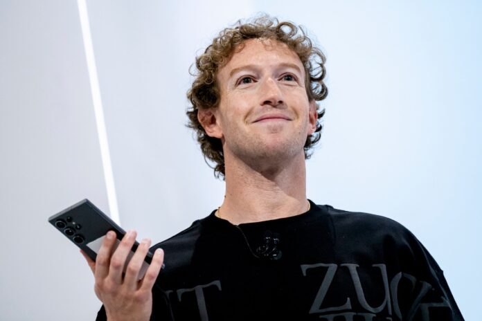 Mark-Zuckerberg-at-Meta-Connect.jpg Mark Zuckerberg smiling while holding a phone on stage at an event