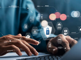 hand typing at laptop and icons across photo