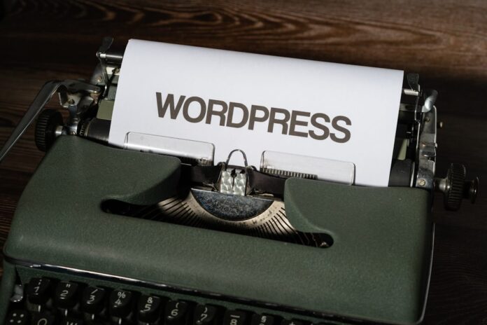nexm5pbegyg.jpg a close up of a typewriter with the word wordpress printed on it