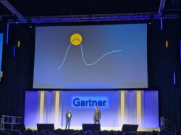 Christine Lee, VP research at Gartner and Leigh McMullen, distinguished VP analyst at Gartner onstage at Gartner Security &amp; Risk Management Summit in London, stood beneath a large screen showing a Gartner hype cycle diagram.