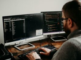 Benchmarking AI-assisted developers (and their tools) for superior AI governance