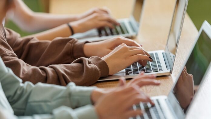 teens-computers-hands-1.jpg ChatGPT gets new parental controls for teen users over next 120 days