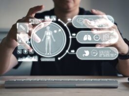 3 Tech Partnerships That Could Streamline Health Care. A user of an AI agent reviews patient health data projected in front of him.