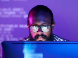 Developer coding in front of computer