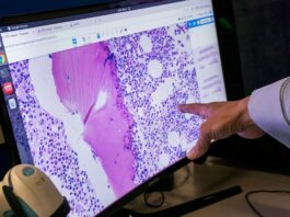 A hand points at a screen showing an array of purple dots and swipes.