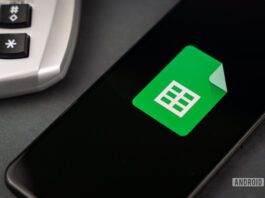 Google Sheets next to calculator stock photo 2