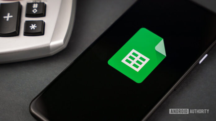 Google-Sheets-next-to-calculator-stock-photo-2.jpg Google Sheets next to calculator stock photo 2