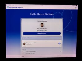 The after-visit summary on Rocco Giuliano’s iPad inside his Boston apartment on Oct. 6. Giuliano, who doesn’t have a primary care physician, recently used an AI platform from Mass General Brigham to be referred to a doctor for a telehealth appointment.