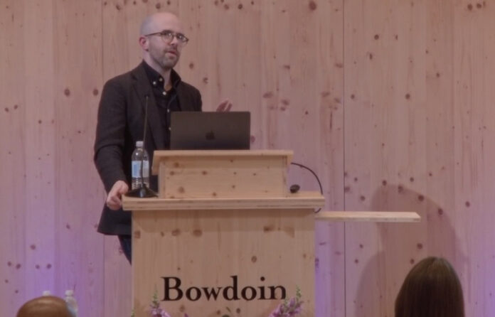 bc-at-podium.jpg Keep Expressing Yourself and Stay Human, Urges AI Expert and Author Brian Christian