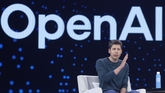 f40569-20251029-open-ai-ceo-sam-altman-sits-and-speaks-in-a-white-chair-in-front-of-text-that-reads.jpeg Above, OpenAI CEO Sam Altman in June.