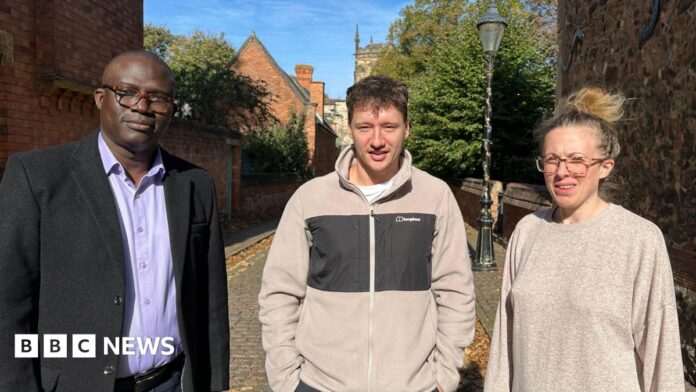 Dr Abiodun Egbetokun, Brett Koenig and and Ruth McKie standing side by side on a cobbled street in the sun
