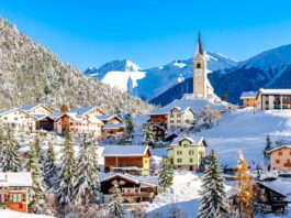 Maximize Your Travel Budget: Smart Savings Tips with ChatGPT A photo of the alpine village Alvaneu in winter, Switzerland (gettyimages-1857988210)