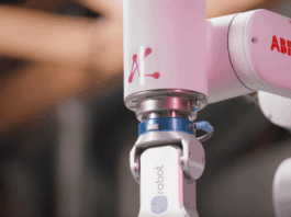 Mbodi to Showcase AI-Agent-Driven Robot Training at TechCrunch Disrupt 2025 Mbod logo on robotic arm