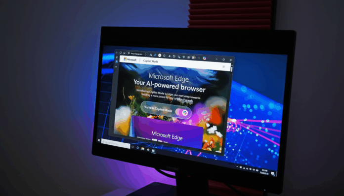 microsoft_edge_copilot_mode_edited_1761478131.png A computer monitor displaying the Microsoft Edge browser in Copilot Mode, with a dark background and blue and purple lighting.