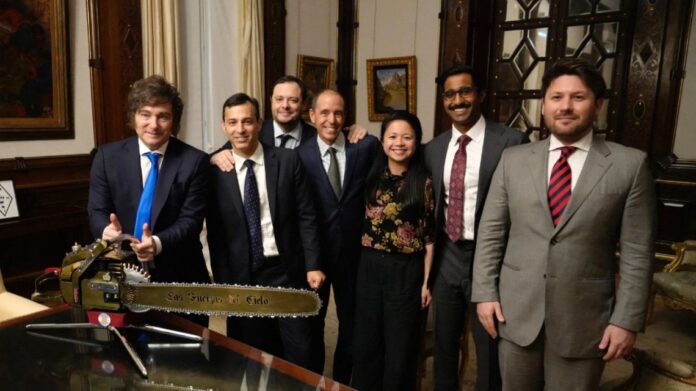 Handout picture released by the Presidency shows President Javier Milei posing for a photo with Benjamin Schwartz, OpenAI Managing Head of Infrastructure Policy and Partnerships; Demian Reidel, president of Nucleoeléctrica Argentina SA; Christopher Lehane, OpenAI Chief Global Affairs Officer; Ivy Lau-Schindewolf, OpenAI Head of International Policy & Partnerships.