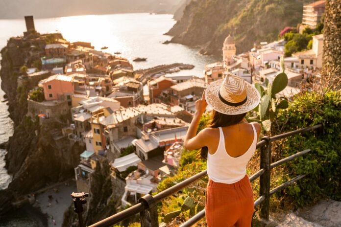 Too burned out to travel? This new app fakes your summer vacation photos for you