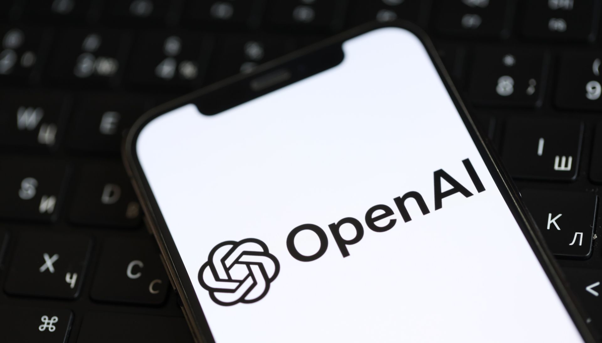 2KzVq8gkFv5n7v3rCCqCoe-1920-80.jpg OpenAI logo on a smartphone screen