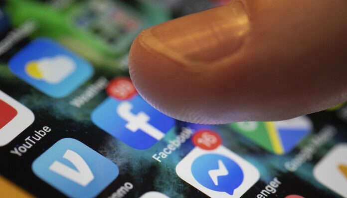 This Aug. 11, 2019, file photo an iPhone displays the apps for Facebook and Messenger in New Orleans. (AP)