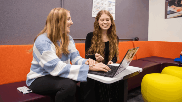 Two women smiling during a Writing Lab appointment