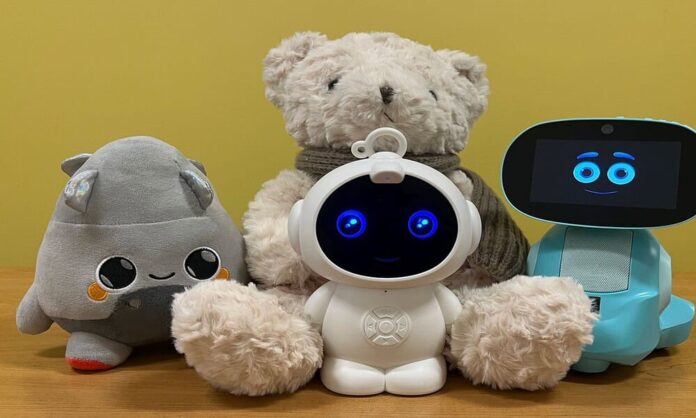 Plush toys and robots with smiling faces on display.