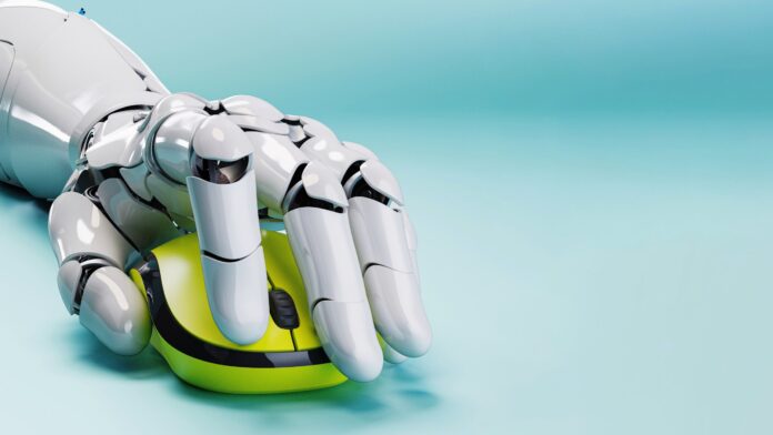 Photo of a robot holding a computer mouse